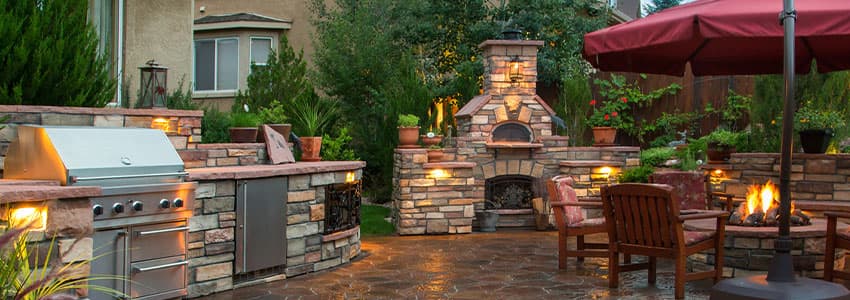 natural gas firepit, grill & fireplace in back yard of home